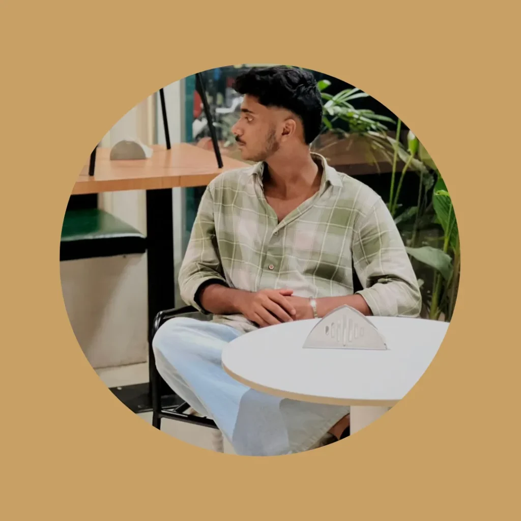top best freelance digital marketing analyst in Sharjah.sitting on chair